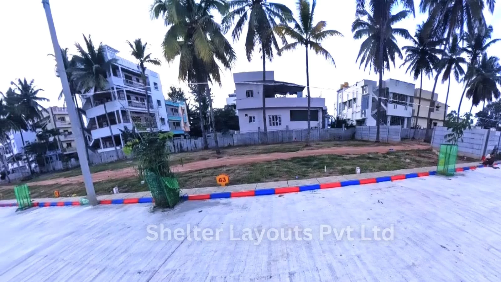 Aerial view of Shelter Sai Krupa Bhoo Vista at Hirandahalli Main Road, highlighting planned infrastructure and wide roads.